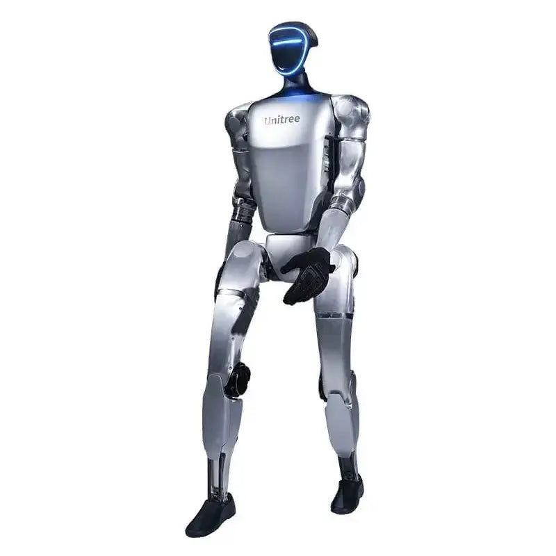 Unitree G1 EDU Standard humanoid robot standing upright, dark grey and white panels, photographed against a light background.