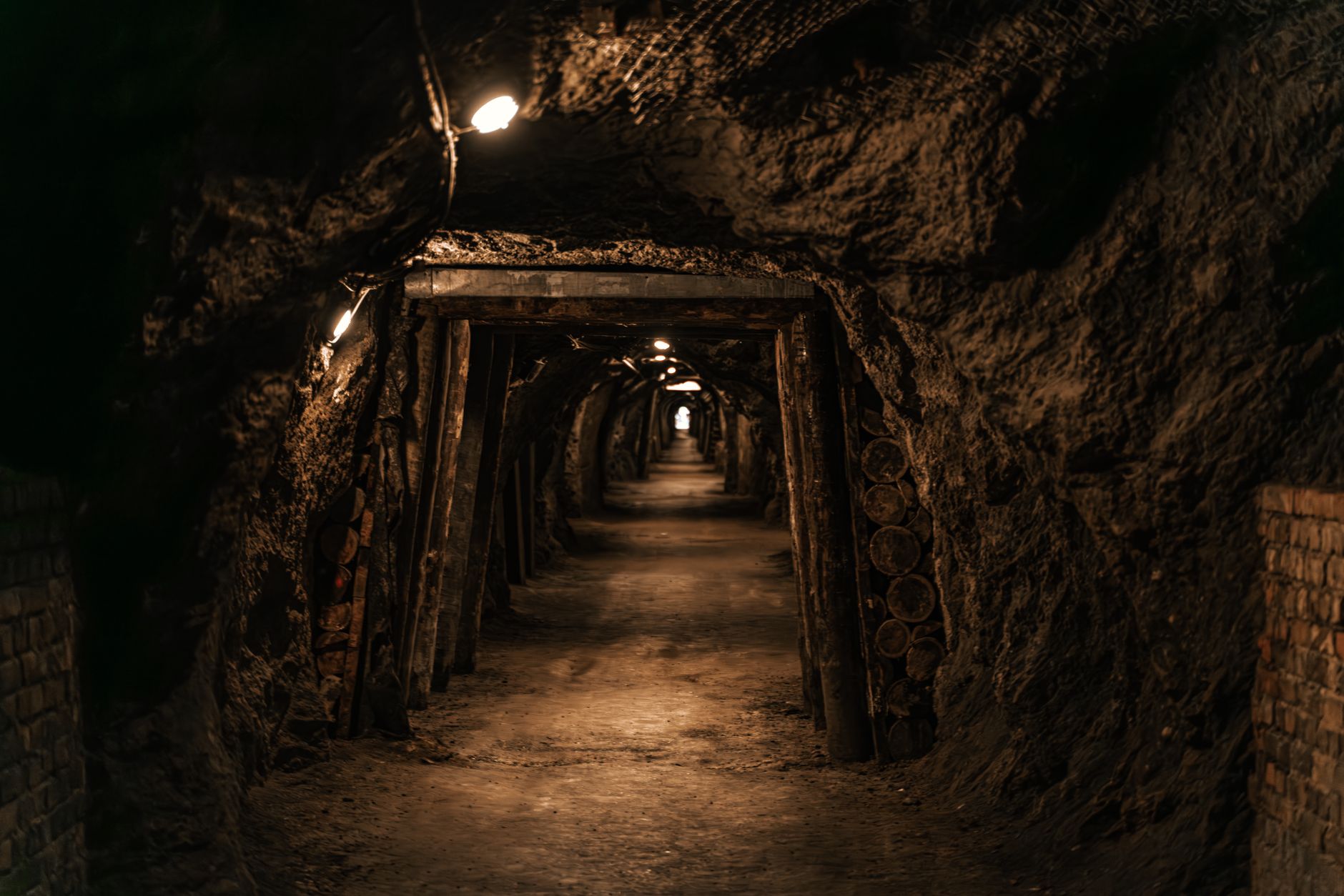 Highlighting the efficiency of modern ASIC miners A dimly lit tunnel in Hinterbrühl, Austria, showcasing an underground cavern.