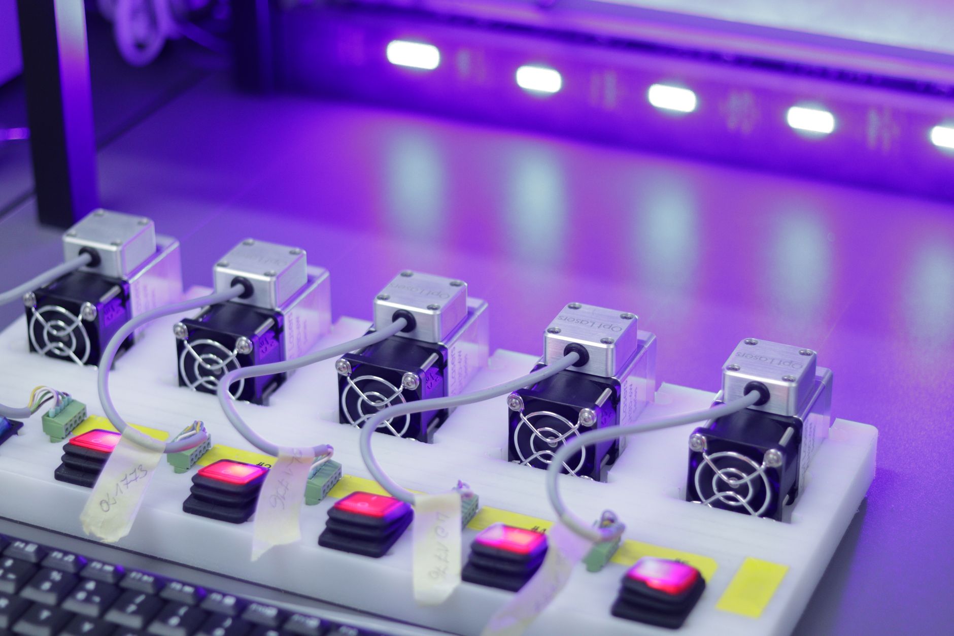 Detailed view of the Antminer S23 Hydro's components Detailed close-up of CNC laser units with glowing controls, ready for precision tasks.