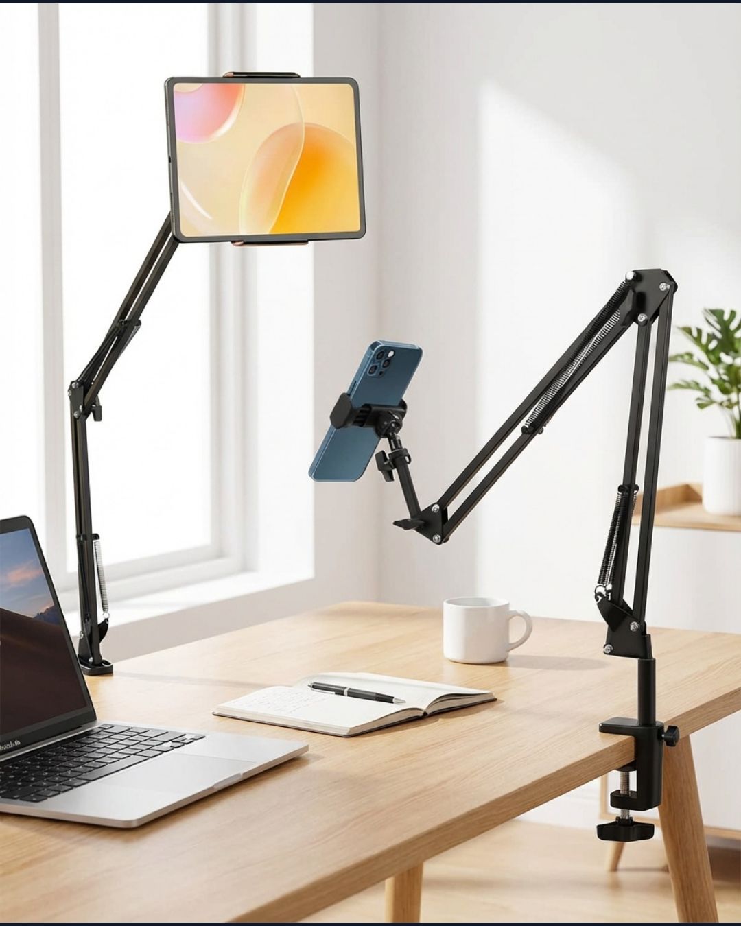 Folding phone holder on home office desk setup with laptop and coffee