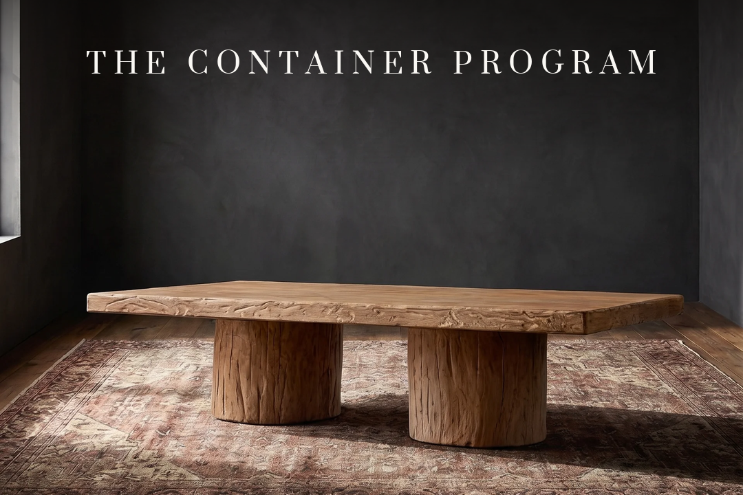 The container program — a reclaimed-wood table in a moody room