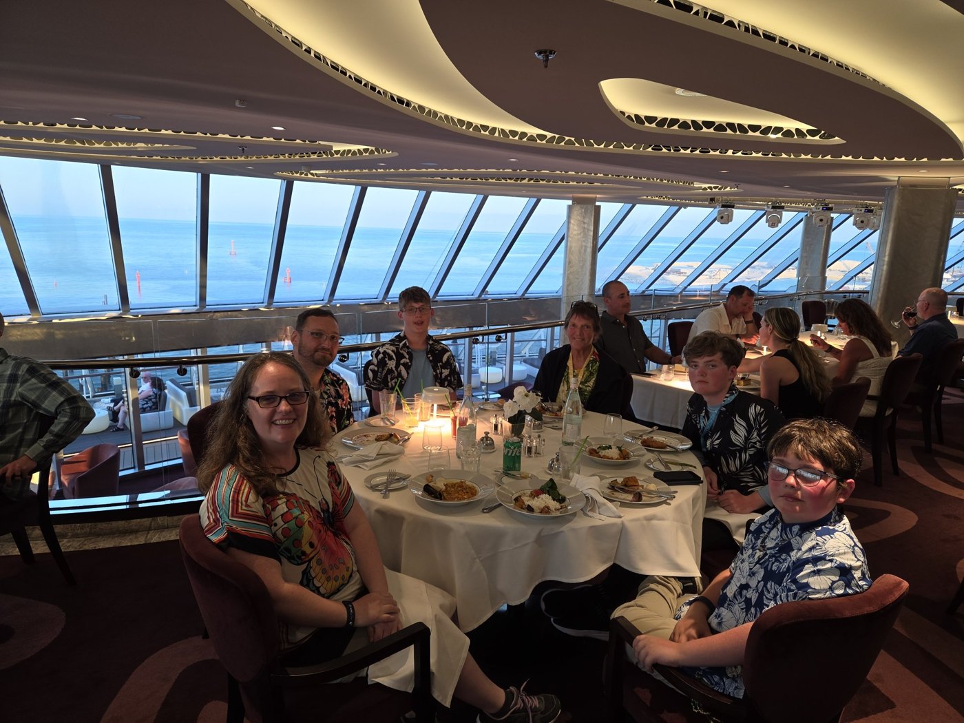 Melinda with her family at dinner on a cruise