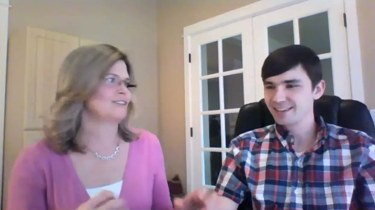 Tyler McNamer and his mom laughing together